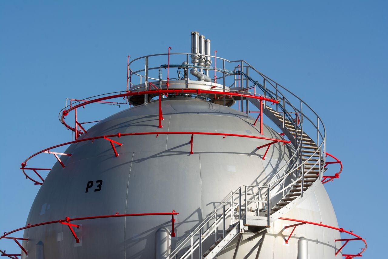 Offerings Close-up view of a large industrial gas storage sphere with a surrounding metal staircase.